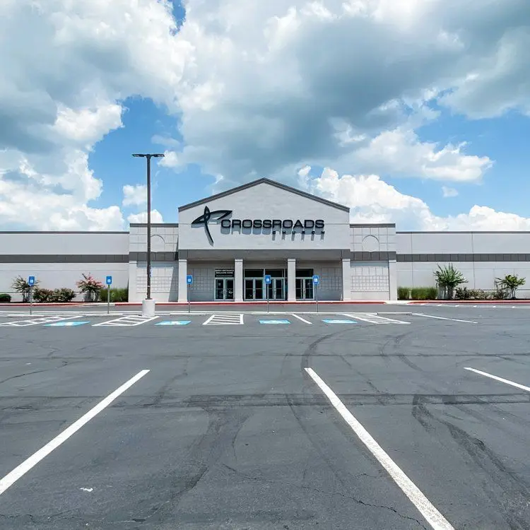 Newly striped parking lot in front of a retail building